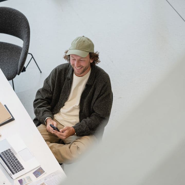 Man at desk with devices